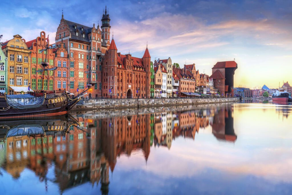 Gdansk with old town and port crane reflected in Motlawa river at sunrise, Poland. gdansk-old-town-1